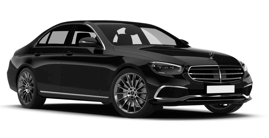 Black Mercedes-Benz luxury sedan featuring a chrome grille, swept headlights, and large multi-spoke alloy wheels, showcasing a sleek four-door coupe-like profile